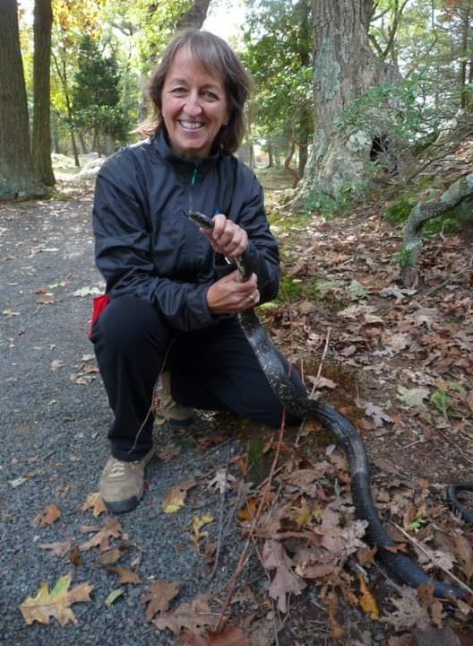 Bet Zimmerman Smith with an eastern rat snake in CT