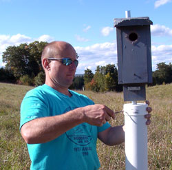 Doug installing boxes. Photo by Bet Zimmerman